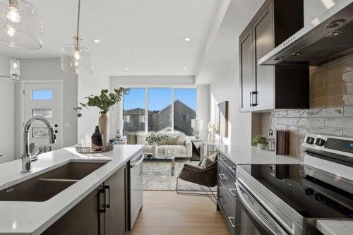 129 Wild Rose Way Se, Calgary, AB - Indoor Photo Showing Kitchen With Double Sink With Upgraded Kitchen