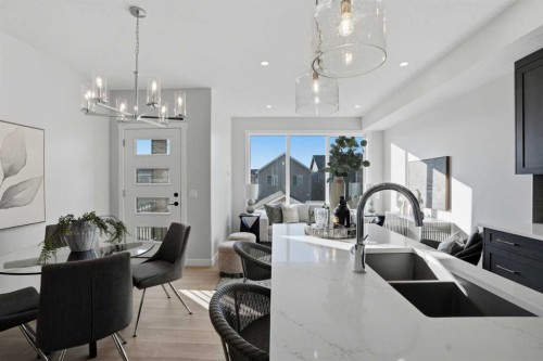 129 Wild Rose Way Se, Calgary, AB - Indoor Photo Showing Kitchen With Double Sink With Upgraded Kitchen