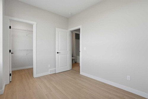129 Wild Rose Way Se, Calgary, AB - Indoor Photo Showing Other Room