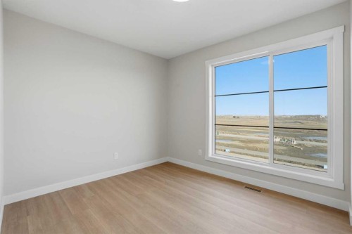 129 Wild Rose Way Se, Calgary, AB - Indoor Photo Showing Other Room