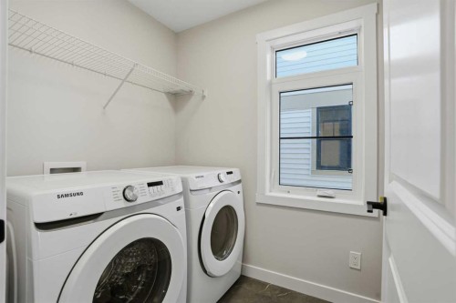 129 Wild Rose Way Se, Calgary, AB - Indoor Photo Showing Laundry Room