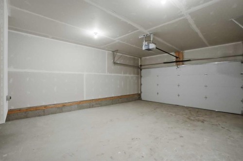 129 Wild Rose Way Se, Calgary, AB - Indoor Photo Showing Garage