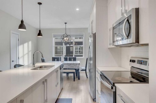 106-72 Cornerstone Manor, Calgary, AB - Indoor Photo Showing Kitchen With Stainless Steel Kitchen With Double Sink With Upgraded Kitchen