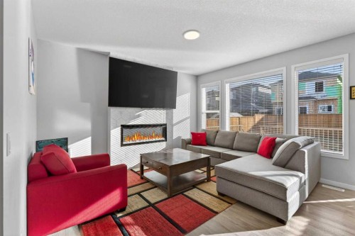 78 Corner Meadows Row Ne, Calgary, AB - Indoor Photo Showing Living Room With Fireplace