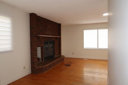 6807 Huntchester Road Ne, Calgary, AB - Indoor With Fireplace