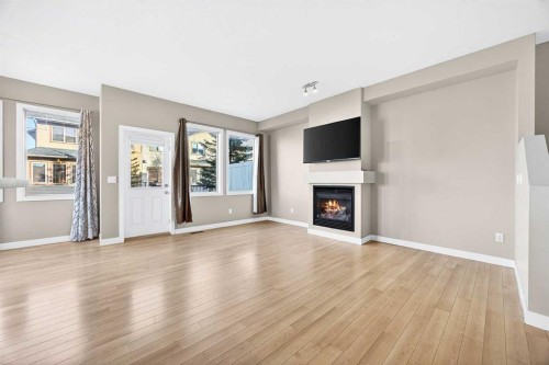 214-413 River Avenue, Cochrane, AB - Indoor Photo Showing Living Room With Fireplace