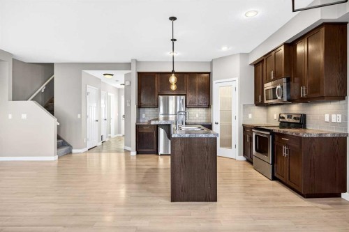 214-413 River Avenue, Cochrane, AB - Indoor Photo Showing Kitchen With Stainless Steel Kitchen