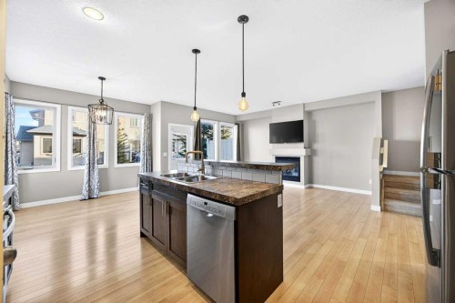 214-413 River Avenue, Cochrane, AB - Indoor Photo Showing Kitchen With Stainless Steel Kitchen With Double Sink With Upgraded Kitchen
