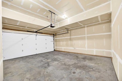 214-413 River Avenue, Cochrane, AB - Indoor Photo Showing Garage