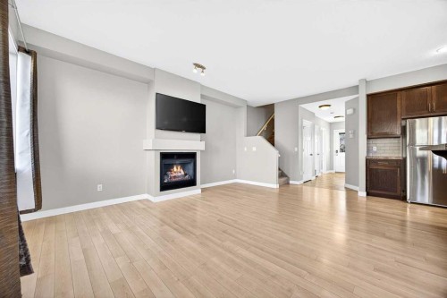 214-413 River Avenue, Cochrane, AB - Indoor With Fireplace
