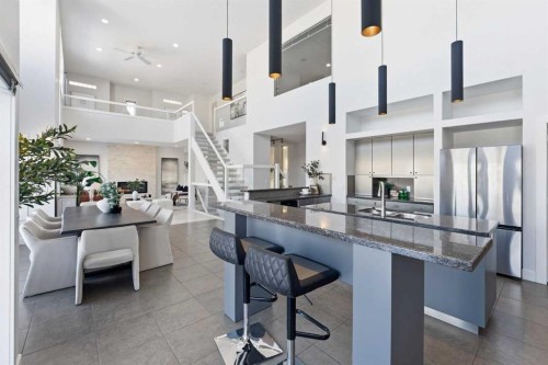 16 Hamptons Cove Nw, Calgary, AB - Indoor Photo Showing Kitchen With Stainless Steel Kitchen With Double Sink With Upgraded Kitchen