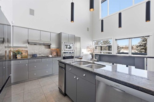 16 Hamptons Cove Nw, Calgary, AB - Indoor Photo Showing Kitchen With Stainless Steel Kitchen With Double Sink