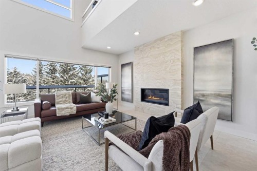 16 Hamptons Cove Nw, Calgary, AB - Indoor Photo Showing Living Room With Fireplace