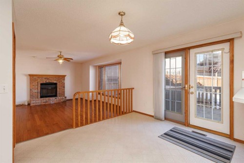 39 Signature Mews Sw, Calgary, AB - Indoor With Fireplace