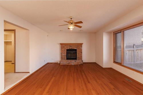 39 Signature Mews Sw, Calgary, AB - Indoor Photo Showing Living Room With Fireplace