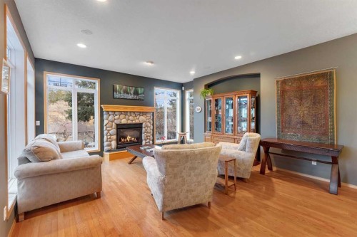 15 Rosery Drive Nw, Calgary, AB - Indoor Photo Showing Living Room With Fireplace