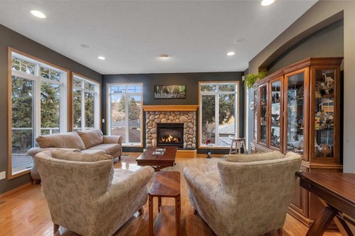 15 Rosery Drive Nw, Calgary, AB - Indoor Photo Showing Living Room With Fireplace