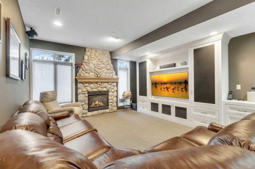 15 Rosery Drive Nw, Calgary, AB - Indoor Photo Showing Living Room With Fireplace