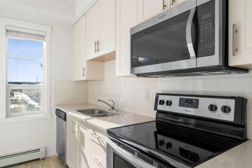 2205-215 Legacy Boulevard Se, Calgary, AB - Indoor Photo Showing Kitchen With Double Sink