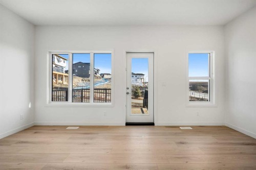 27 Heritage Heath, Cochrane, AB - Indoor Photo Showing Other Room