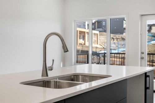 27 Heritage Heath, Cochrane, AB - Indoor Photo Showing Kitchen With Double Sink