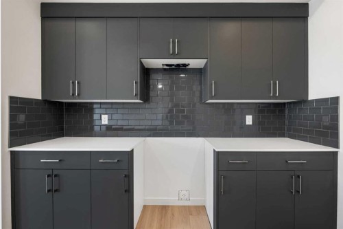 27 Heritage Heath, Cochrane, AB - Indoor Photo Showing Kitchen With Upgraded Kitchen