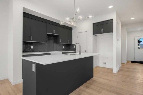 27 Heritage Heath, Cochrane, AB - Indoor Photo Showing Kitchen With Upgraded Kitchen