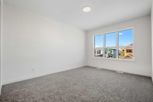 27 Heritage Heath, Cochrane, AB - Indoor Photo Showing Other Room