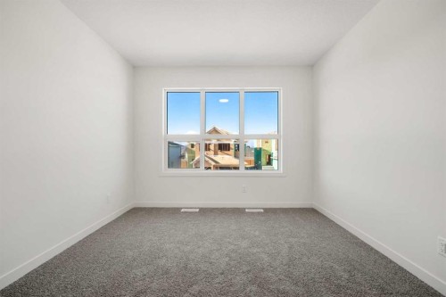 27 Heritage Heath, Cochrane, AB - Indoor Photo Showing Other Room