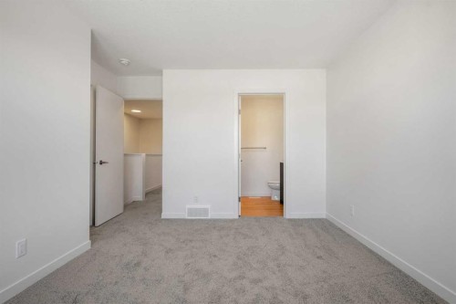 27 Heritage Heath, Cochrane, AB - Indoor Photo Showing Other Room