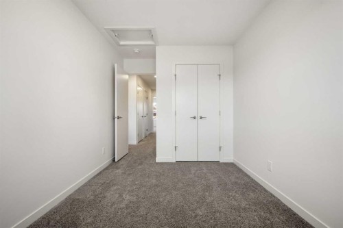 27 Heritage Heath, Cochrane, AB - Indoor Photo Showing Other Room