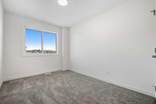 27 Heritage Heath, Cochrane, AB - Indoor Photo Showing Other Room