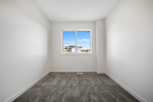 27 Heritage Heath, Cochrane, AB - Indoor Photo Showing Other Room