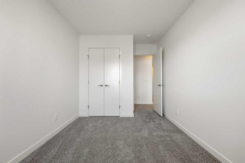 27 Heritage Heath, Cochrane, AB - Indoor Photo Showing Other Room