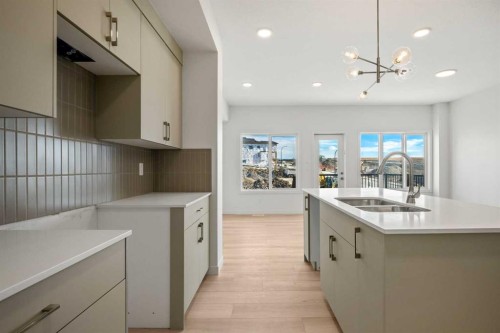 31 Heritage Heath, Cochrane, AB - Indoor Photo Showing Kitchen With Double Sink