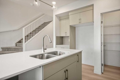 31 Heritage Heath, Cochrane, AB - Indoor Photo Showing Kitchen With Double Sink