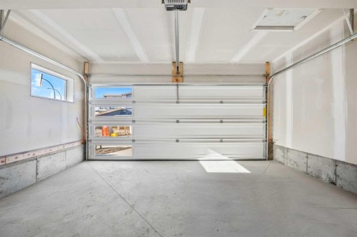31 Heritage Heath, Cochrane, AB - Indoor Photo Showing Garage