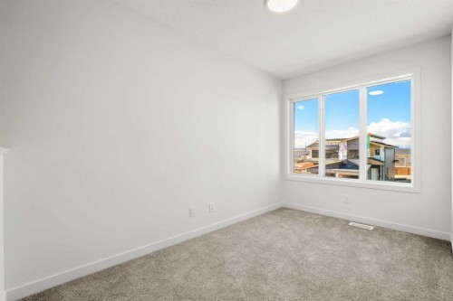 31 Heritage Heath, Cochrane, AB - Indoor Photo Showing Other Room