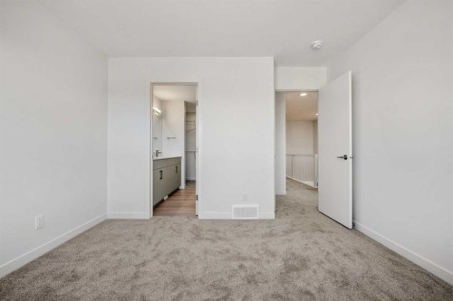 31 Heritage Heath, Cochrane, AB - Indoor Photo Showing Other Room