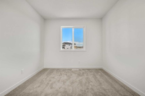 31 Heritage Heath, Cochrane, AB - Indoor Photo Showing Other Room