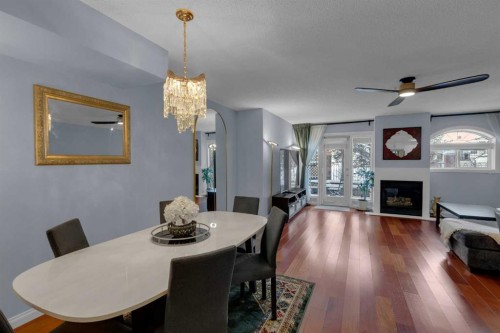 103-923 15 Avenue Sw, Calgary, AB - Indoor Photo Showing Dining Room With Fireplace