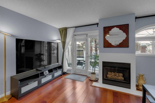 103-923 15 Avenue Sw, Calgary, AB - Indoor Photo Showing Living Room With Fireplace