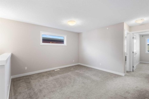 13 Howse Row Ne, Calgary, AB - Indoor Photo Showing Other Room