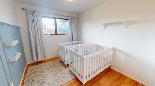 84 Sunmount Road Se, Calgary, AB - Indoor Photo Showing Bedroom