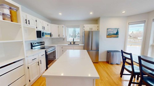 84 Sunmount Road Se, Calgary, AB - Indoor Photo Showing Kitchen With Stainless Steel Kitchen