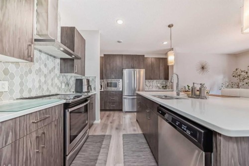 17 Walgrove Manor Se, Calgary, AB - Indoor Photo Showing Kitchen With Double Sink With Upgraded Kitchen