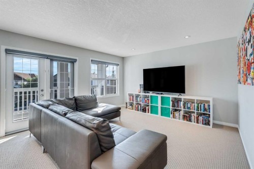 113 Copperpond Bay Se, Calgary, AB - Indoor Photo Showing Living Room