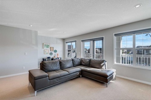 113 Copperpond Bay Se, Calgary, AB - Indoor Photo Showing Living Room