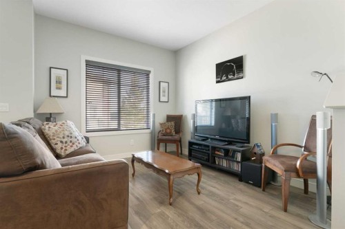 1403 Jumping Pound Common, Cochrane, AB - Indoor Photo Showing Living Room