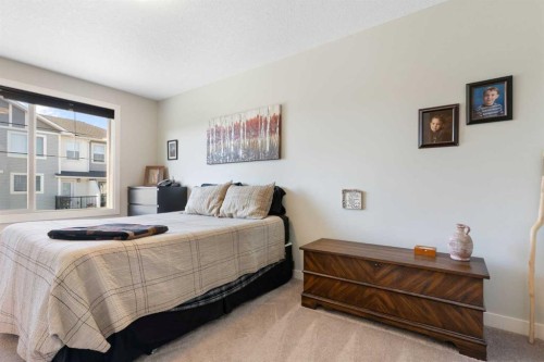 1403 Jumping Pound Common, Cochrane, AB - Indoor Photo Showing Bedroom